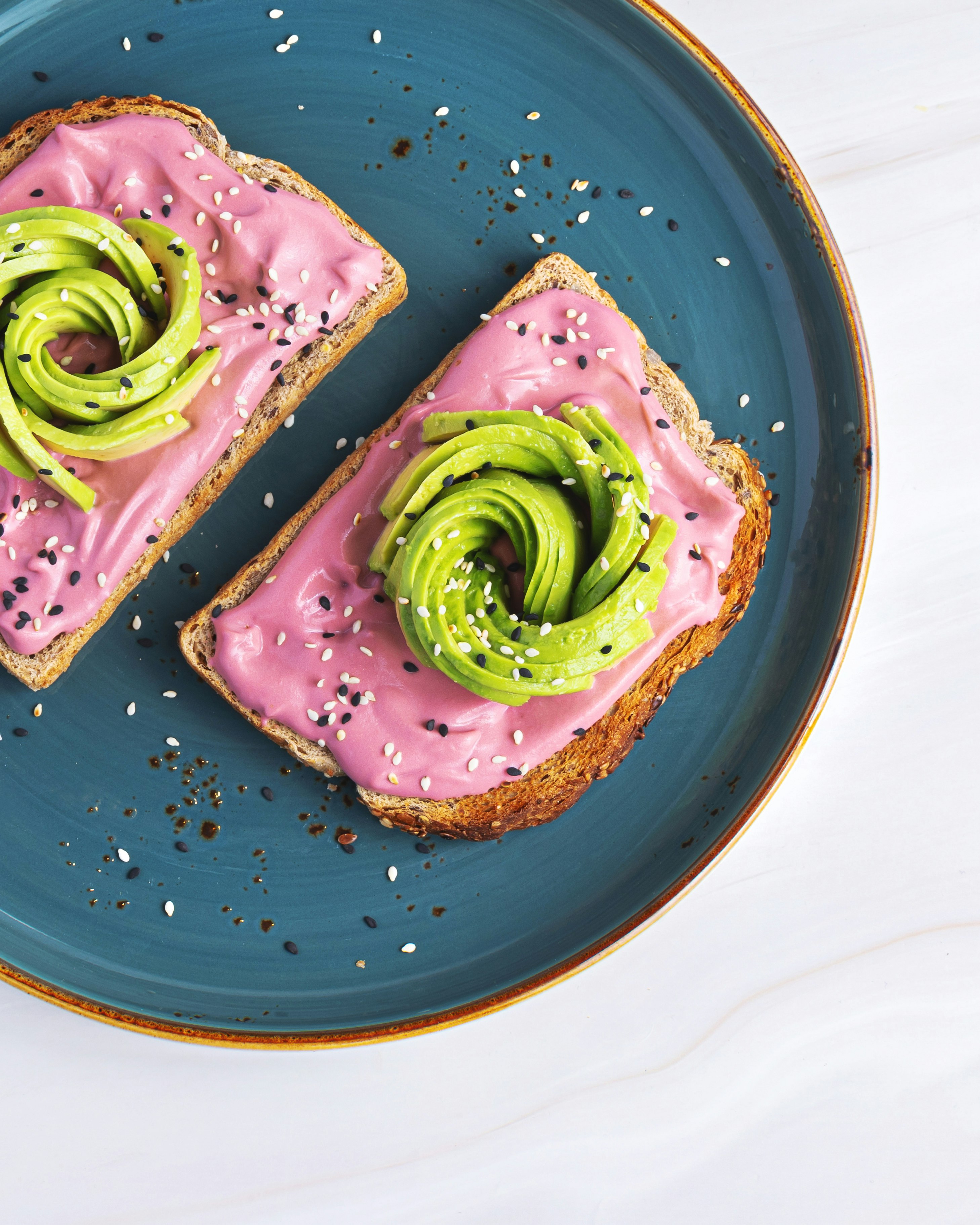 purple and green cake on blue ceramic plate